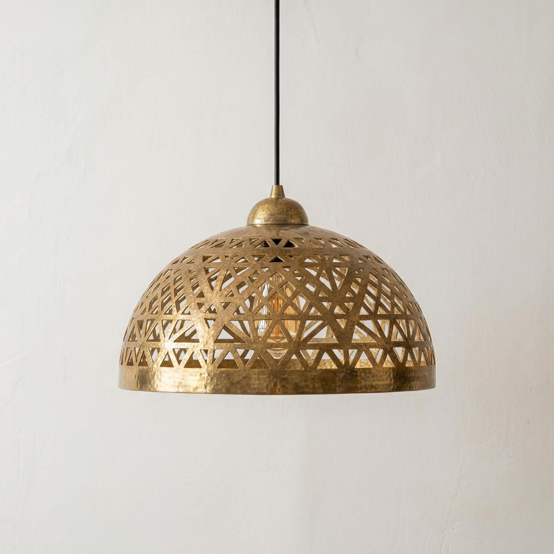 Handmade Moroccan pendant lamp with brass dome and geometric cutout pattern